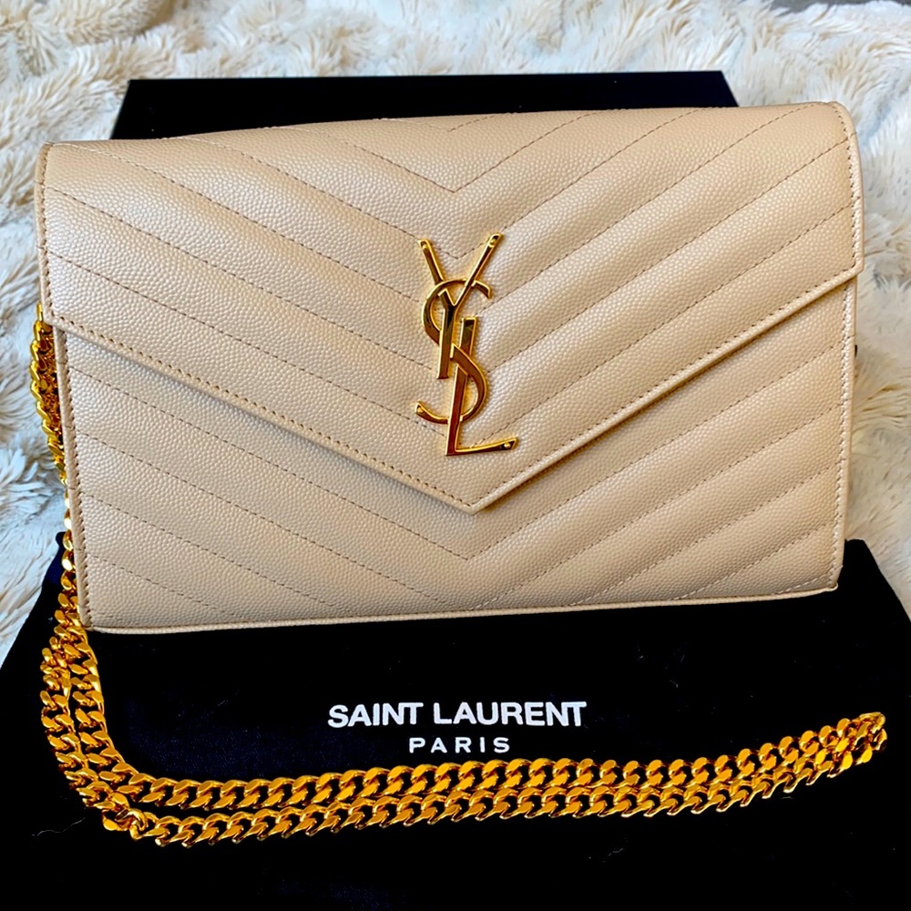 YSL Monogram beige envelope on a chain wallet.